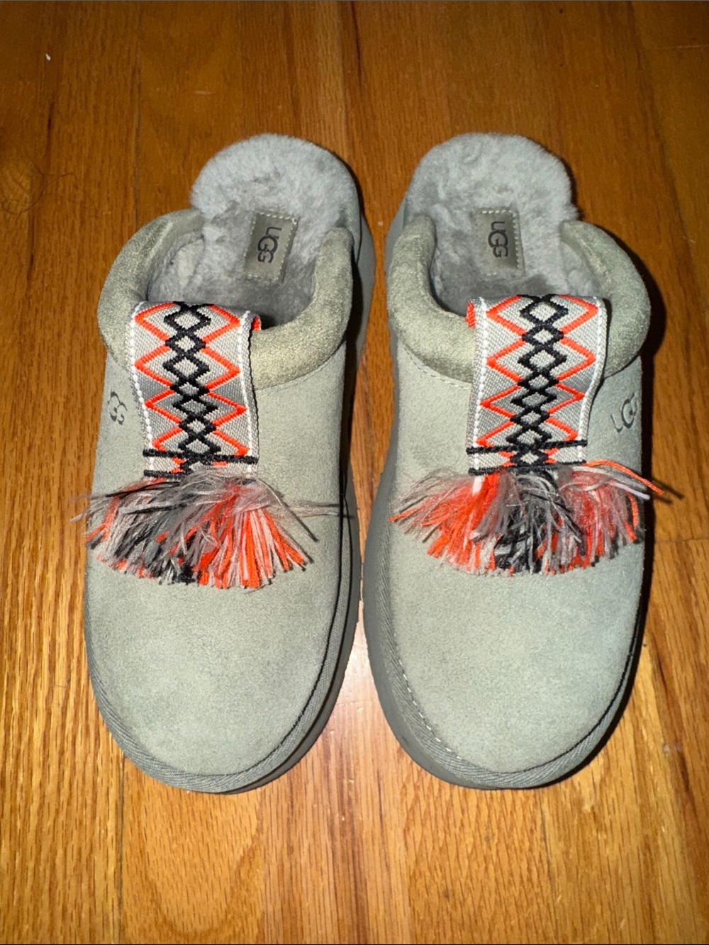 UGG Gray Suede Slip-On Mules with Orange and Black Tassels